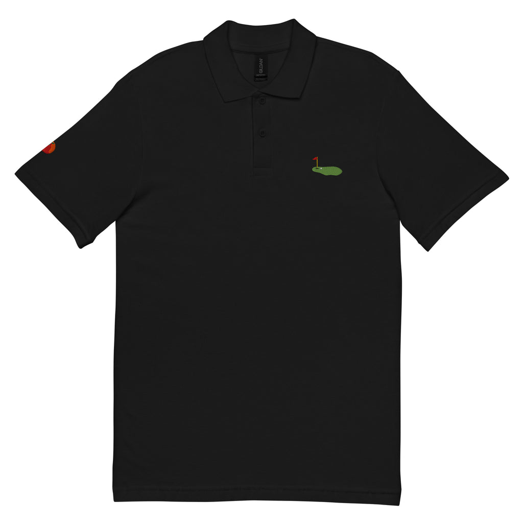Polo de golf negre brodat amb green – Tot Queda en Família